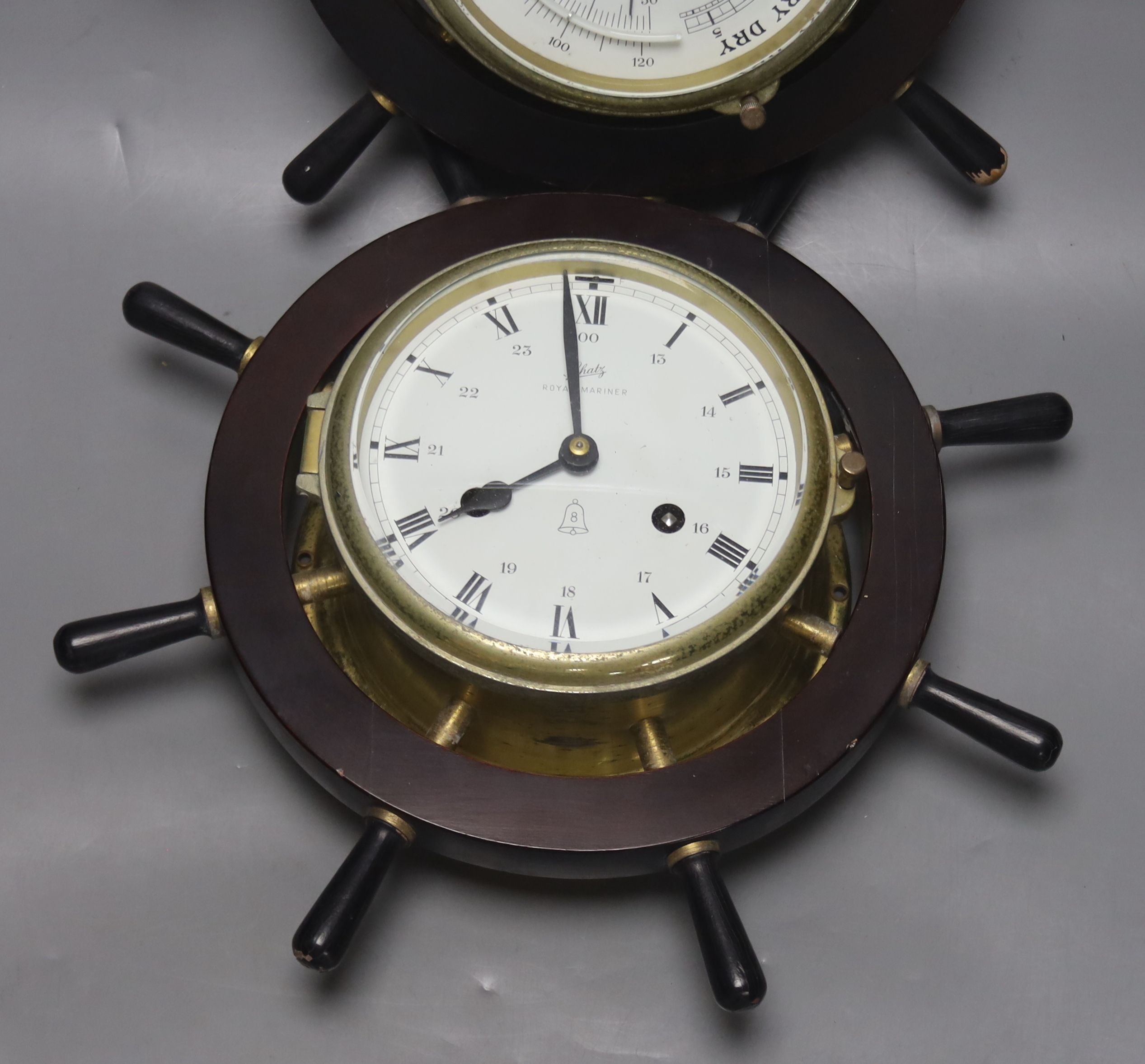 A pair of Schatz marine style wall hanging instruments: a clock and a holosteric compensated barometer, dials 13cm